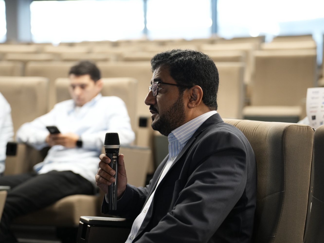 Suhail Ahmad Rana presenting the ICCSDFAI 2026 paper beside the projected title slide